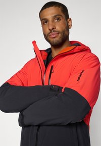 Salomon HIGHLAND JACKET - Suusajakk - cherry tomato/deep black