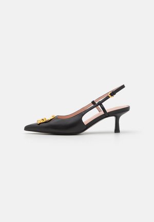 Black leather slingback pump with pointed toe, gold hardware detail, and a mid-height heel. Features cut-out side design and adjustable strap.