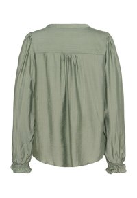 Blouse vert clair avec une finition texturée, présentant un détail de dos froncé et des manches à poignets élastiqués. Encolure ronde, coupe décontractée.