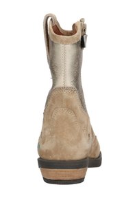 Boot with a metallic gold back and beige suede front. Features a textured finish, side zipper, and a black rubber sole.