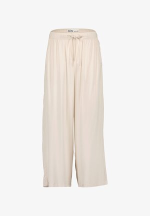 Jasno-beżowe, długości do kolan kuloty wykonane z miękkiego materiału, z elastycznym paskiem w talii i sznurkiem do regulacji. Posiadają boczne kieszenie i luźny krój.