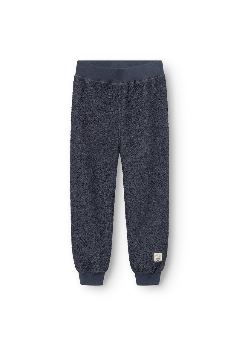 Flauschige, dunkelmarine blaue Jogginghosen mit geripptem Bund und Bündchen; aus einem strukturierten, weichen Stoff und mit einem kleinen Etikett an der unteren linken Seite.