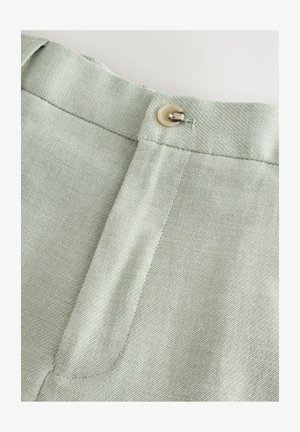 Lysgrønne bukser med en struktureret stof, en glat linning og en knaplukning øverst.