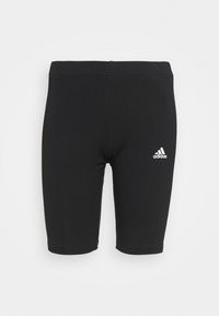 Černé sportovní šortky vyrobené z elastické tkaniny. Mají přiléhavý střih a malé bílé logo Adidas na levé noze.