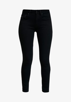 Sorte denim skinny jeans med en glat overflade, fem lommer og metalbeslag. Har en klassisk talje og en tætsiddende ben-design.