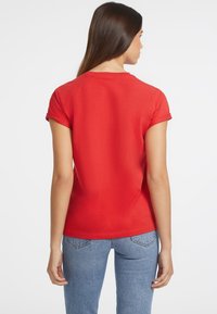 Guess Jeans - T-shirt z nadrukiem