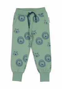 Ljusgröna sweatpants med ett upprepat mönster av en marinblå lionhuvud, elastisk midja med dragsko och avslutade anklar. Mjuk bomullsmaterial.