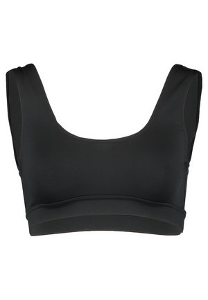 Mustmust jakk, millel on laiad rihmad, sile tekstuur ja õmblusteta disain. Omab mõõdukat ümarat kaelust ja toetavat aluspinda.