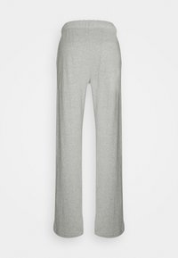 Lys grå, vide bukser med elastisk talje, lavet af blødt materiale. Minimalistisk design, ingen synlige mønstre eller metaldele.