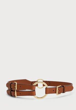Ceinture double en cuir marron avec deux boucles circulaires dorées et des fermoirs dorés réglables, présentée sur un fond neutre.