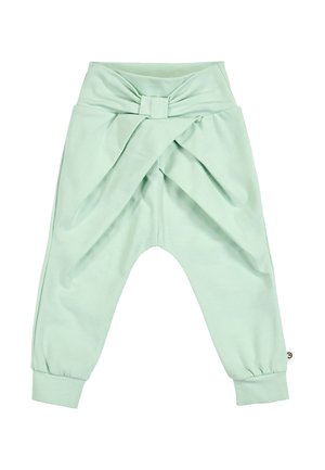 Pantalon bébé vert clair avec une taille haute ornée d'un grand nœud et des chevilles retroussées.