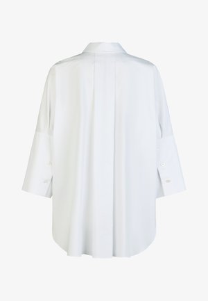 White oversized long-sleeve shirt with back pleat detail and buttoned cuffs, displayed flat on a white background.