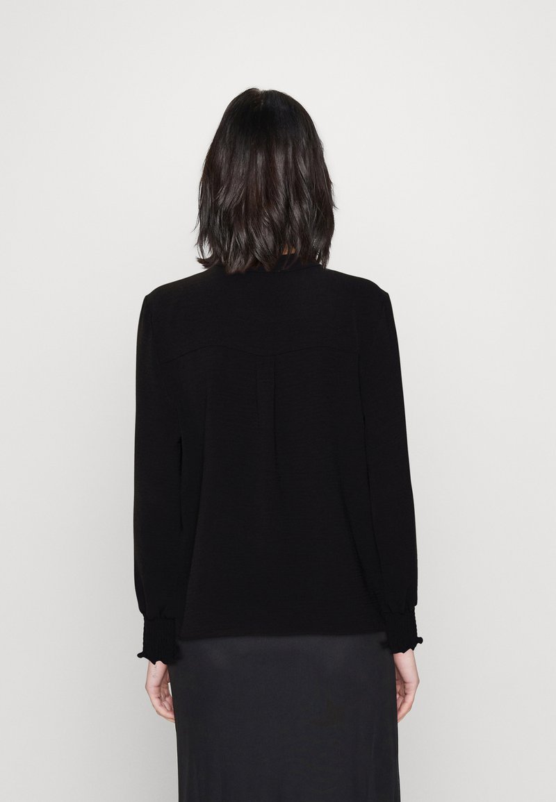 Only ONLMETTE V-NECK LS SMOCK TOP NOOS W 15284309 wolwit/ecru kopen bij