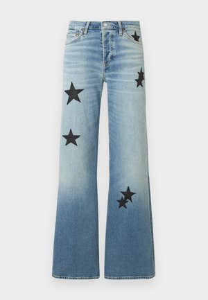 Light blue flared jeans with black star patches on front thighs and lower legs, featuring front pockets and button closure.