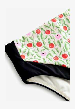 Bañador de bikini multicolor con un estampado floral en el que destacan cerezas rojas y flores rosas sobre un fondo crema, con una cinturilla negra.