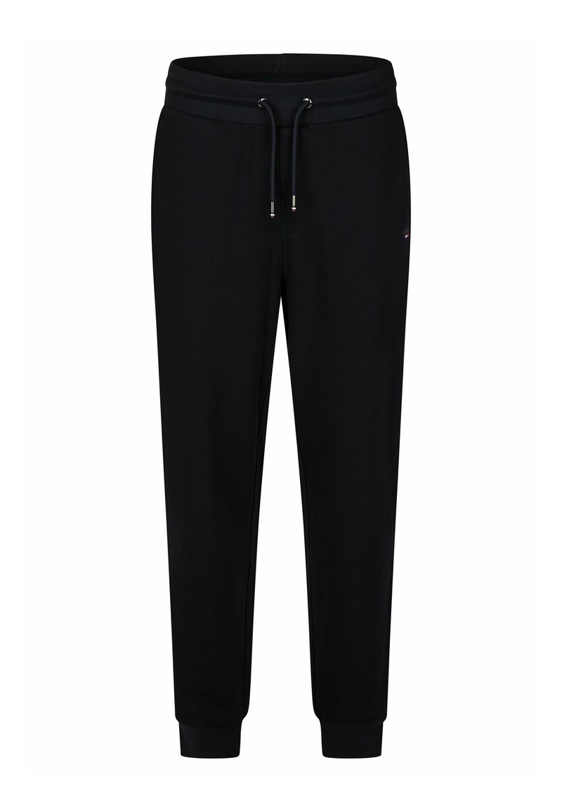 Zwarte joggingbroek van zacht materiaal, met een elastische tailleband met trekkoord, geribbelde boorden en een klein logo-detail aan de zijkant.