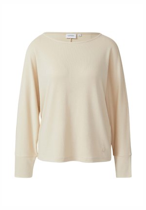 Jasnobeżowa bluzka z długim rękawem, dekoltem w łódkę, luźnym krojem, prążkowaną fakturą oraz małym logo przy dole.