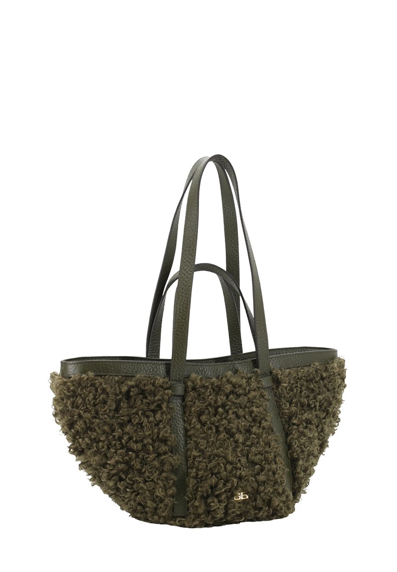 Olive green tote bag featuring curly textured fabric on the front, smooth leather sides, reinforced handles, and a small gold logo detail.