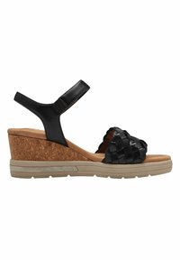 Sandali wedge in pelle nera con cinturino intrecciato, soletta in sughero e suola in gomma. Cinturino alla caviglia regolabile per una vestibilità sicura.