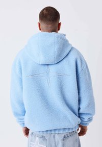 Sélectionné, bleu clair