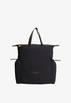Czarna torba typu tote Tommy Hilfiger Marina Club z podwójnymi uchwytami, bocznymi ściągaczami, przednią kieszenią oraz subtelnym logo marki.
