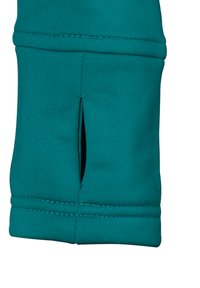Teal atletisk ærme med en tætsiddende pasform, der har en udskæring nær cuffen. Fremstillet af strækbart materiale med en glat tekstur.