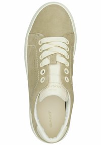 Beige suede sneaker with round toe, white laces, and rubber sole. Features eyelets for laces and brand logo on the insole.