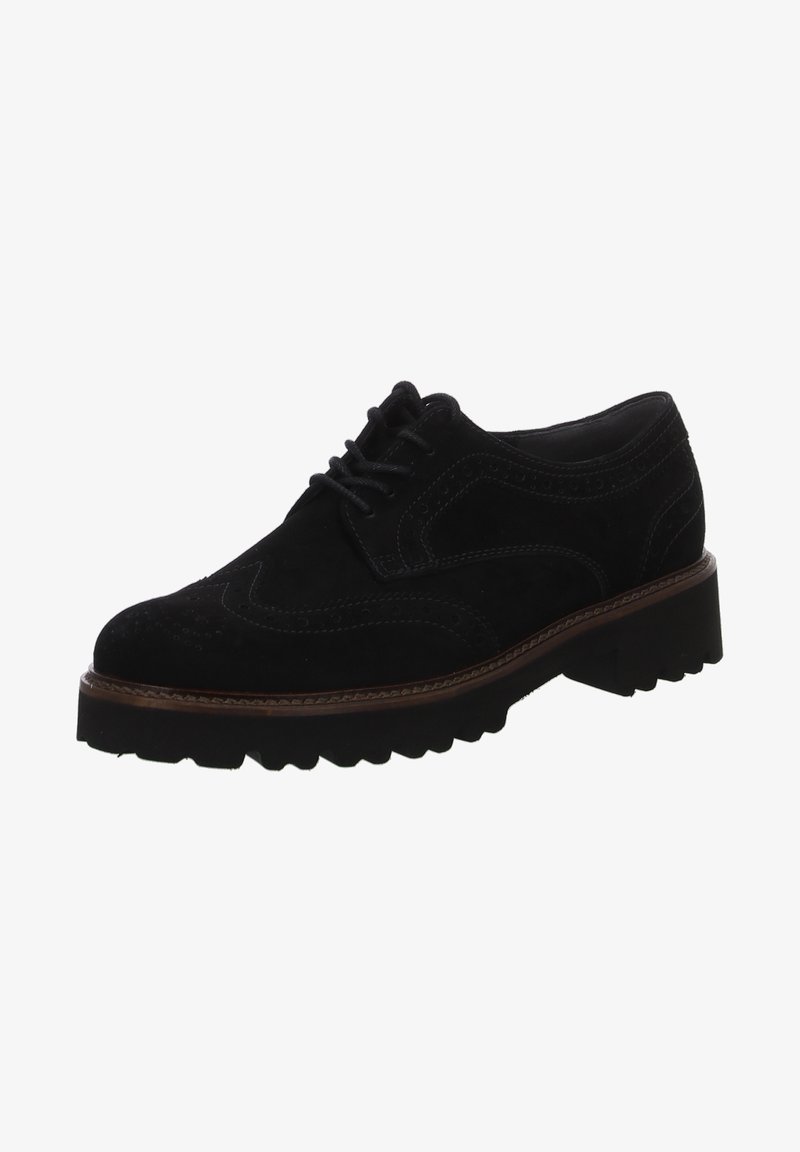Chaussure Oxford en daim noir avec détails brogues, devant à lacets et une semelle en caoutchouc épaisse et texturée. Présente une couture contrastante marron.