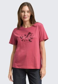 Katoenen t-shirt in rozentint met korte mouwen, voorzien van een bloemrijke grafische print in donkerdere tinten en een ronde hals.