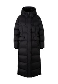 Manteau en duvet noir avec capuche, présentant une silhouette longue et droite, une texture matelassée et des poches zippées sur les côtés. Fermeture à cordon au niveau du cou.