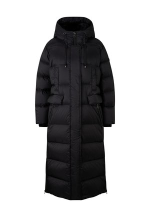 Manteau en duvet noir avec capuche, présentant une silhouette longue et droite, une texture matelassée et des poches zippées sur les côtés. Fermeture à cordon au niveau du cou.
