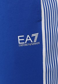EA7 Emporio Armani PANTALONI - Treniņtērpa apakšdaļas - lapis blue