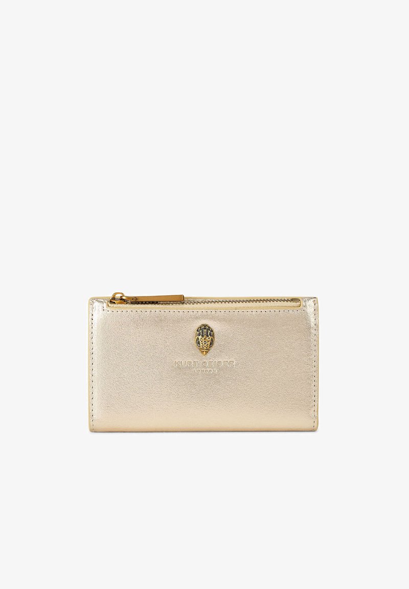 Gold metallic leather wallet with zippered top, featuring a small gold and black animal head emblem and embossed "Kurt Geiger London" logo.