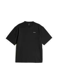 T-shirt nera a maniche corte con colletto rotondo, dotata di piccolo logo bianco "G-STAR" sul lato sinistro del petto, esposta piatta su uno sfondo bianco.