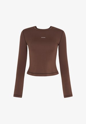 Brown long-sleeve fitted crop top with round neckline and small white "WRSTBHVR" logo centered on the chest.