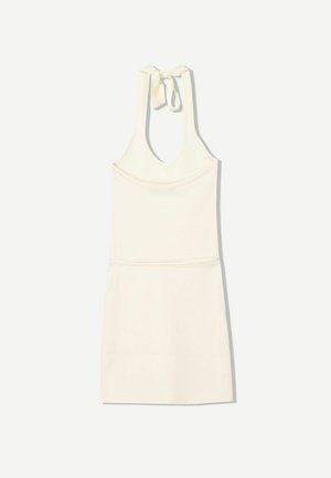 White sleeveless dress with a deep V-neck and a tie closure at the back. Smooth, lightweight fabric with an A-line silhouette.