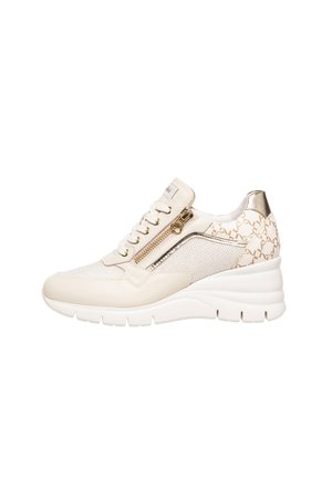 Wedge sneaker crafted from beige mesh and leather, featuring a gold zip, lace-up front, and patterned accent on the heel.