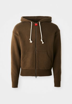 Sweatshirt com fecho éclair castanho, em malha texturada, com cordão branco ajustável, dois bolsos frontais e bainha e punhos canelados.