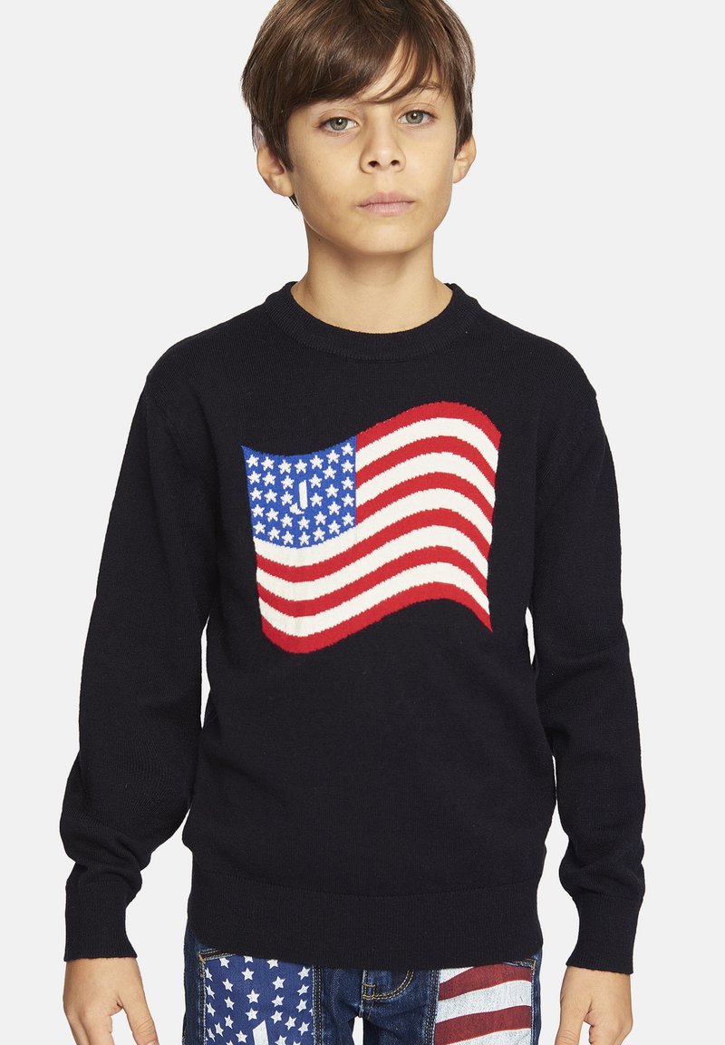 Black sweater featuring an American flag design. The flag is knit with red stripes and blue field with stars. Ribbed cuffs and hem.
