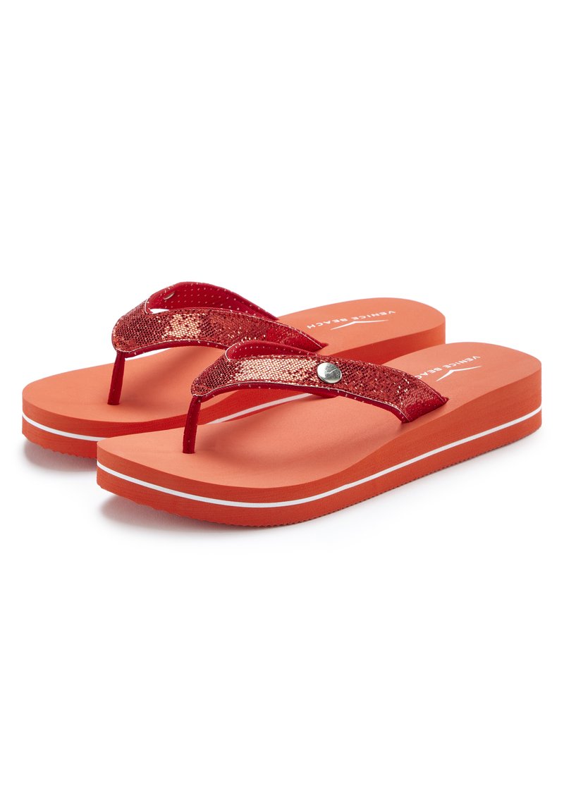 Red flip-flops with textured straps, featuring a metallic accent and a smooth orange sole with a white striped detail.