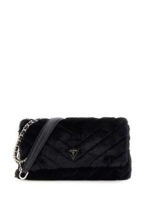 Black faux fur crossbody bag with quilted pattern, silver chain strap, and Guess logo plaque on front flap.