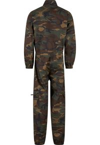 Terepmintás overál hosszú ujjakkal, gallérral, rugalmas mandzsettákkal és cipzáras zsebekkel. Főként barna, zöld és fekete árnyalatokban.