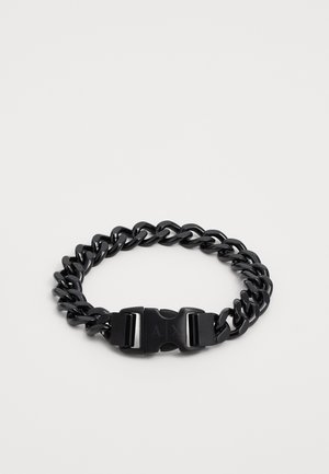 Must musträngist valmistatud musta ketist käevõru, millel on omavahel ühendatud lingid ja tugev kinnitussüsteem. Sile pind koos elegantse disainiga.