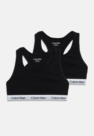 Dve čierne športové podprsenky Calvin Klein pre deti s bielymi značkovými elastickými pásmi, dizajn racerback, veľkosť 8/10 rokov, 128/140 cm.