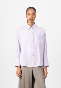 Lilac striped button-up shirt with a collar, single chest pocket, and long sleeves with wide cuffs. Light fabric, casual fit.