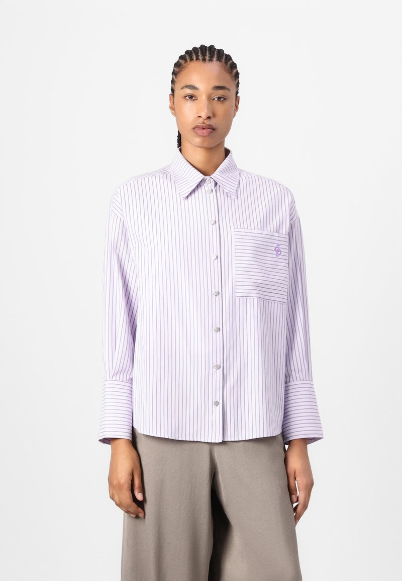 Lilac striped button-up shirt with a collar, single chest pocket, and long sleeves with wide cuffs. Light fabric, casual fit.