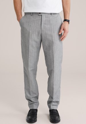 - Spodnie materiałowe