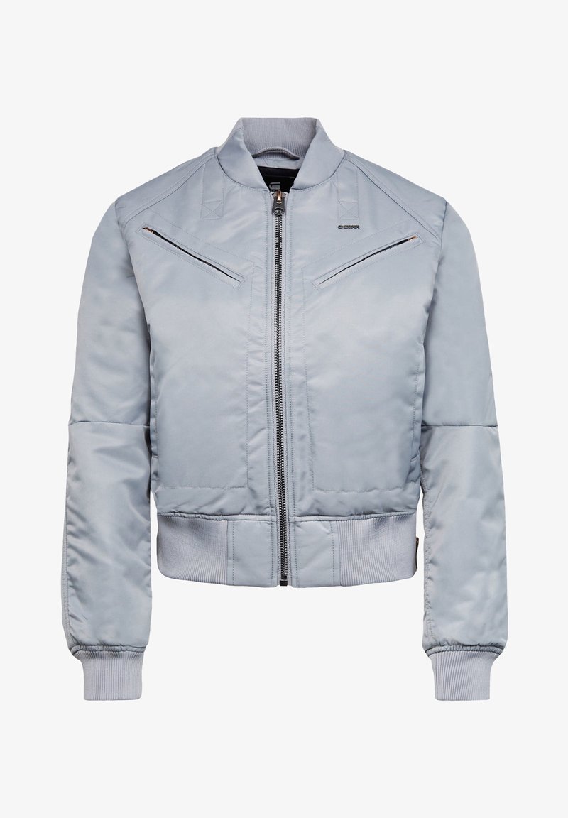 Veste bomber gris clair avec fermeture éclair à l'avant, deux poches poitrine zippées en biais, poignets côtelés et taille côtelée.