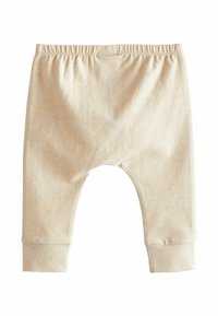 Pantaloni beige chiaro per bambini realizzati in tessuto morbido, con vita elastica, polsini aderenti e vestibilità comoda con ampio spazio per il movimento.