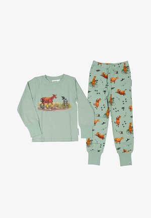 Børnesæt med lysegrøn langærmet skjorte og bukser med illustrationer af orange køer, der bærer gule støvler og kører på cykler.